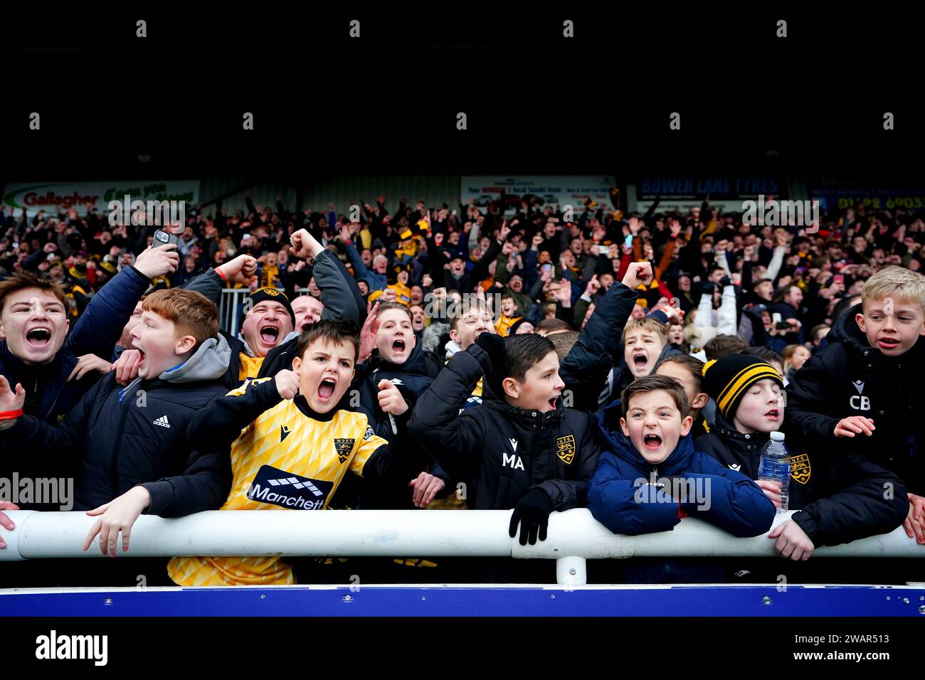 Maidstone United fans celebrate at the end of the Emirates FA Cup Third