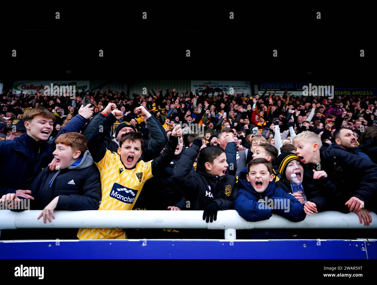 Maidstone United fans celebrate at the end of the Emirates FA Cup Third