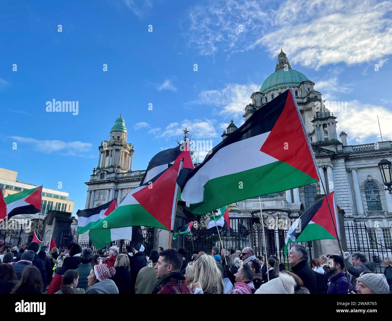 People take part in a pro-Palestine march and rally at Belfast City