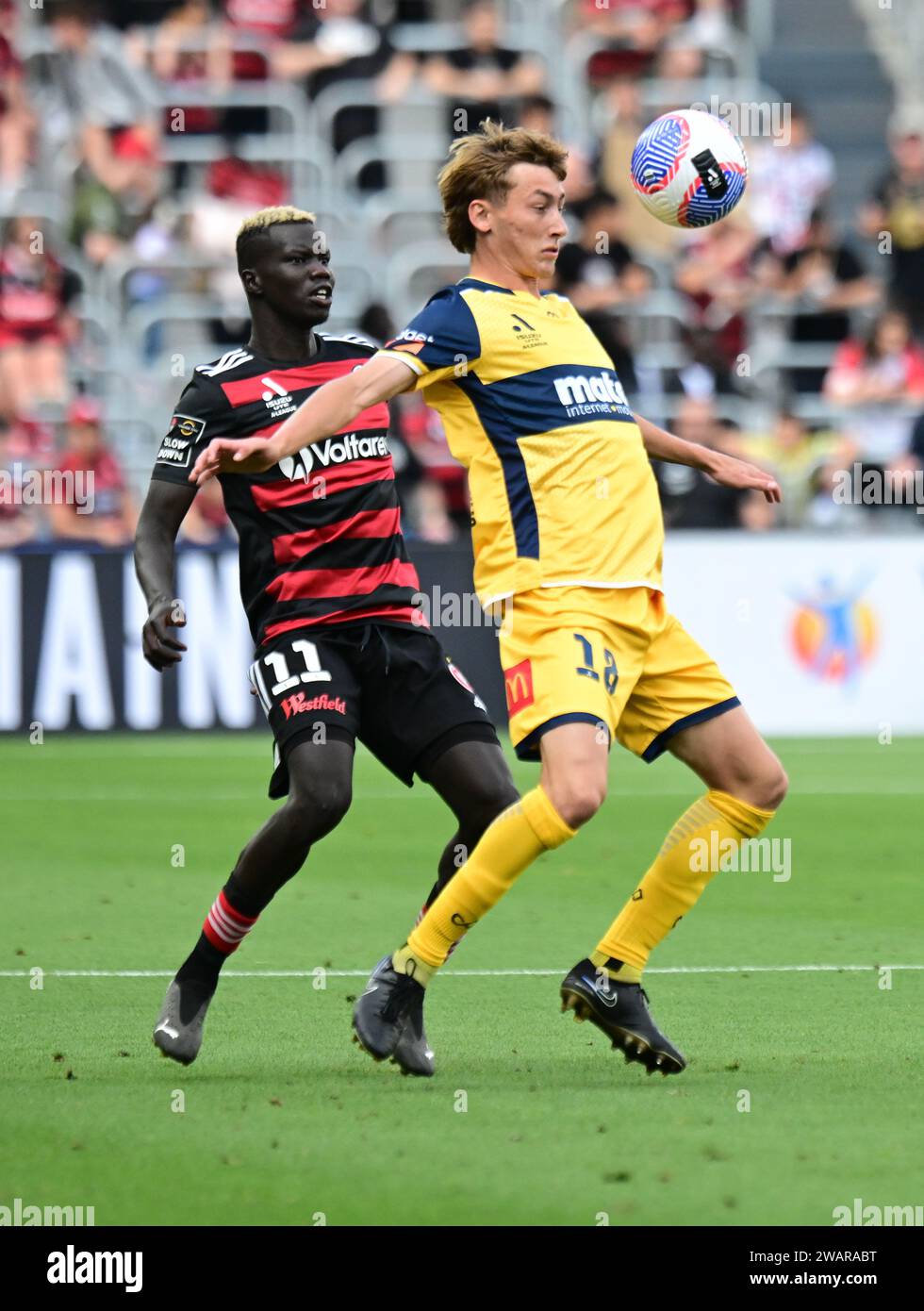 Jacob Brett Farrell (R) of the Central Coast Mariners and Valentino Kuach Yuel (L ) of the Western Sydney Wanderers FC seen in action during the 2023–24 A-League Men's season round 11 match between Western Sydney Wanderers FC and Central Coast Mariners at CommBank Stadium. Final score; Central Coast Mariners 1: 0 Western Sydney Wanderers. Stock Photo