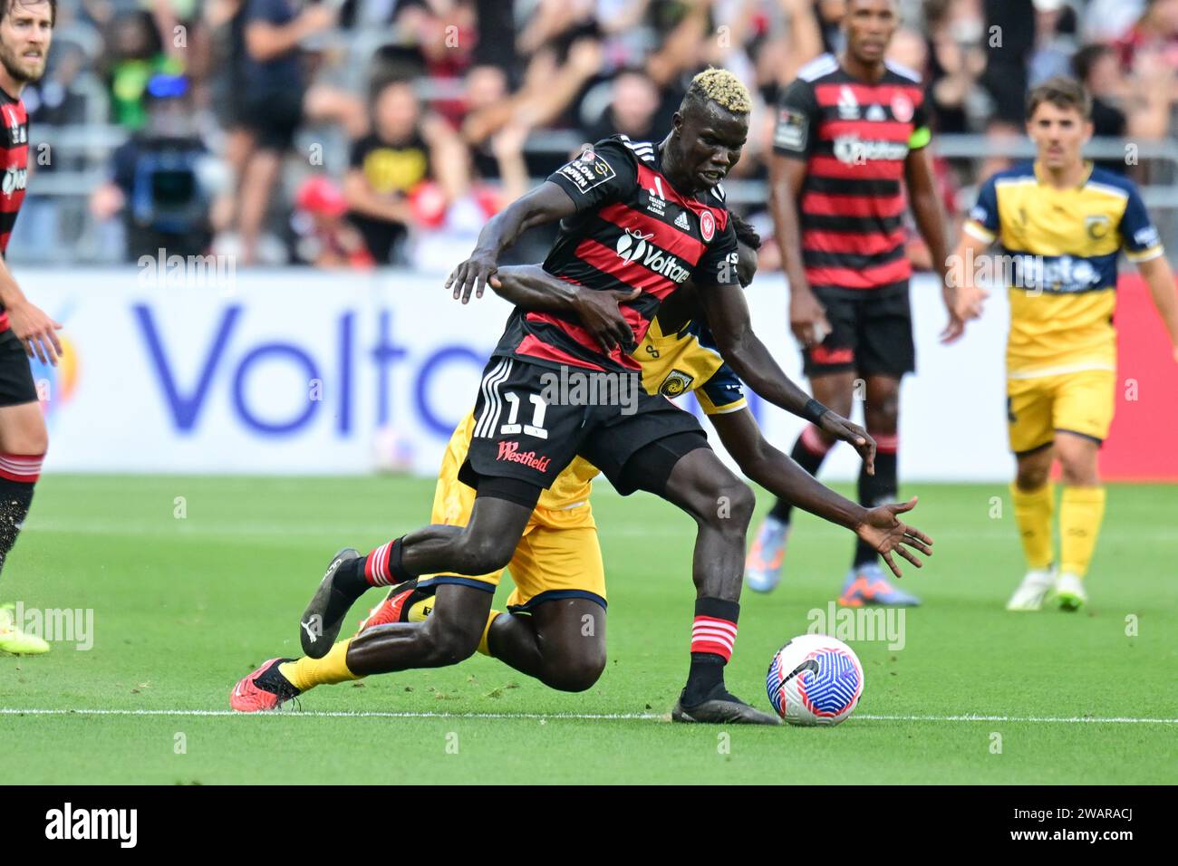 Parramatta, Australia. 06th Jan, 2024. Valentino Kuach Yuel (L) of the Western Sydney Wanderers FC and Alou Mawien Kuol (R) of the Central Coast Mariners seen in action during the 2023-24 A-League Men's season round 11 match between Western Sydney Wanderers FC and Central Coast Mariners at CommBank Stadium. Final score; Central Coast Mariners 1: 0 Western Sydney Wanderers. Credit: SOPA Images Limited/Alamy Live News Stock Photo