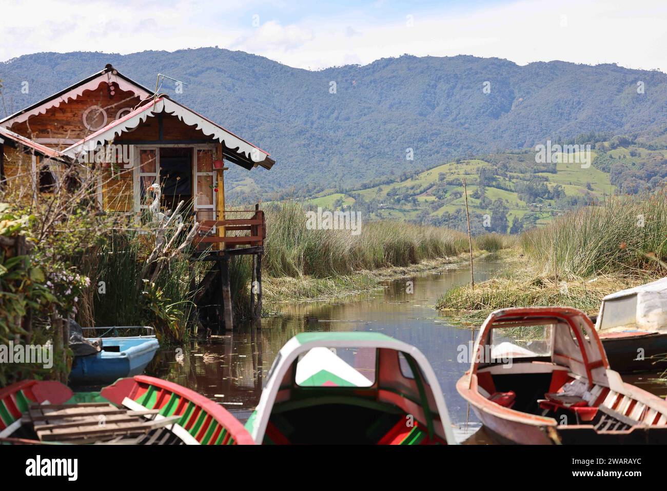 Pasto. 5th Jan, 2024. This photo taken on Jan. 5, 2024 shows several boats berthing on a river in El Encano in the department of Narino, Colombia. Credit: Zhou Shengping/Xinhua/Alamy Live News Stock Photo