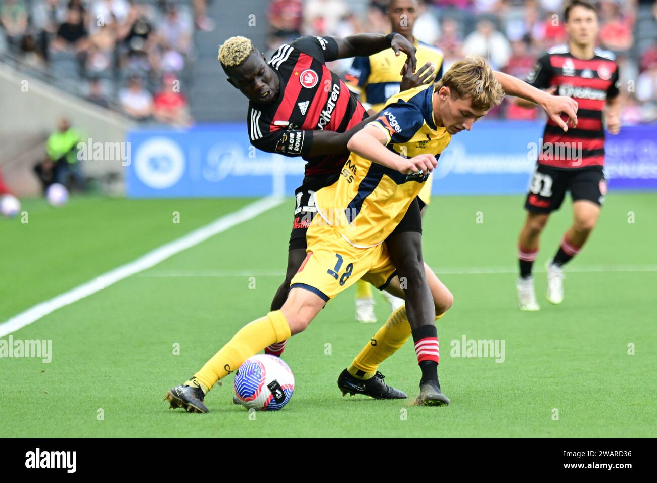 Parramatta, Australia. 06th Jan, 2024. Jacob Brett Farrell (L) of the Central Coast Mariners and Valentino Kuach Yuel (R) of the Western Sydney Wanderers FC seen in action during the 2023-24 A-League Men's season round 11 match between Western Sydney Wanderers FC and Central Coast Mariners at CommBank Stadium. Final score; Central Coast Mariners 1: 0 Western Sydney Wanderers. (Photo by Luis Veniegra/SOPA Images/Sipa USA) Credit: Sipa USA/Alamy Live News Stock Photo