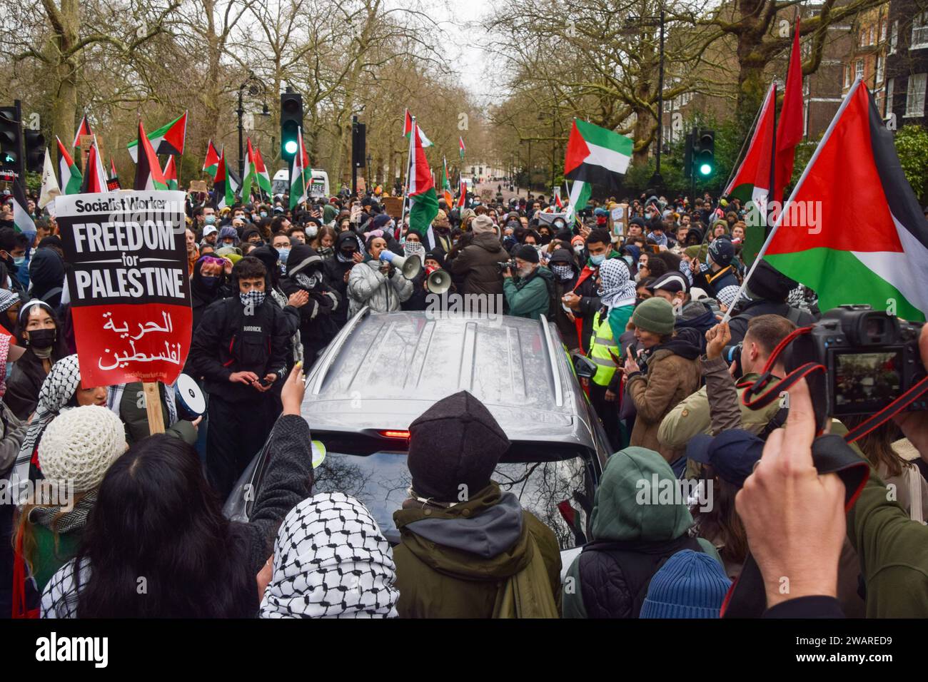 London, UK. 6th January 2024. Pro-Palestine protesters surround a car