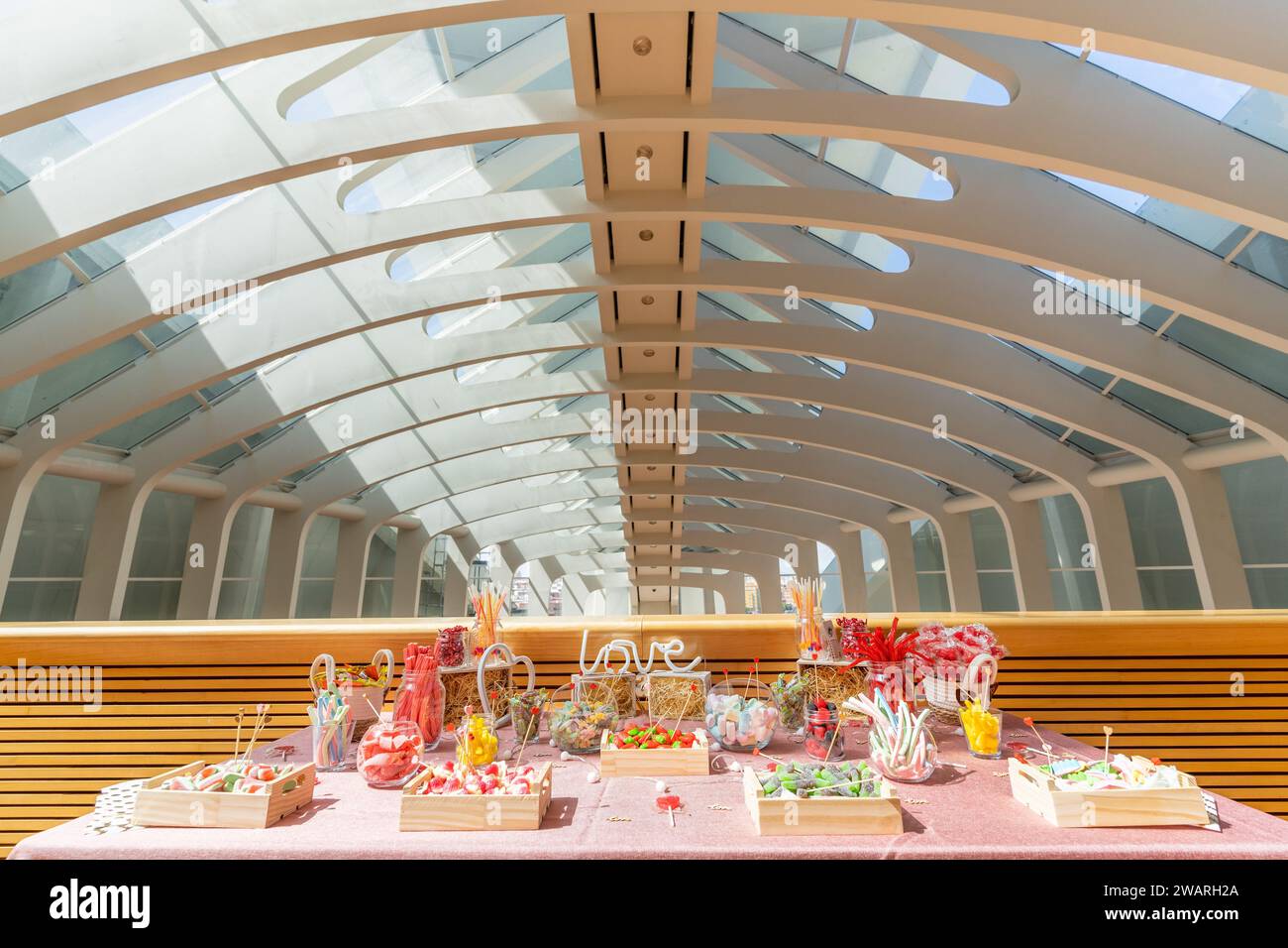 An array of colorful and freshly prepared meals on display on a wooden ...