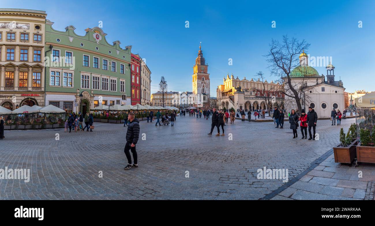 KRAKOW, POLAND - DECEMBER 27, 2023: Picturesque old market square during christmas time.  The Main Square is  surrounded by historic townhouses (kamie Stock Photo