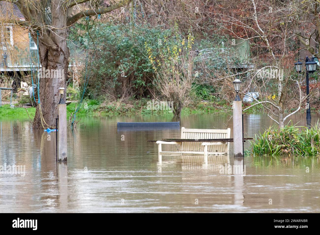 Old Windsor, UK. 6th January, 2024. A flooded garden in a house on Ham Island in Old Windsor