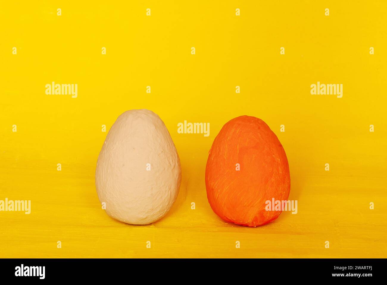 Colorful Easter eggs. Easter decorative hand-painted eggs on a yellow plaster background.easter concept, Stock Photo