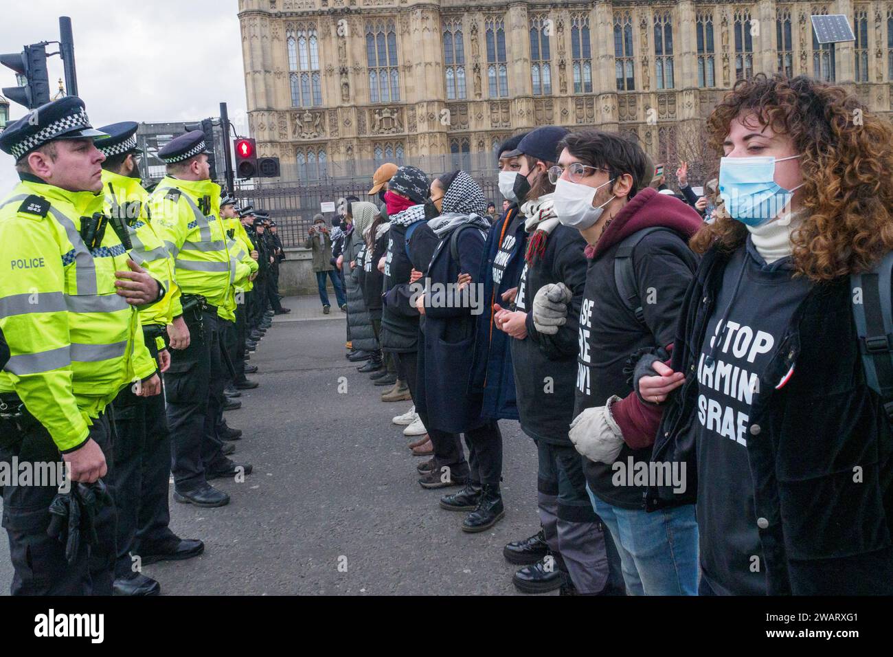 London uk 6 jan 2024 police stop the marchers on westminster bridge