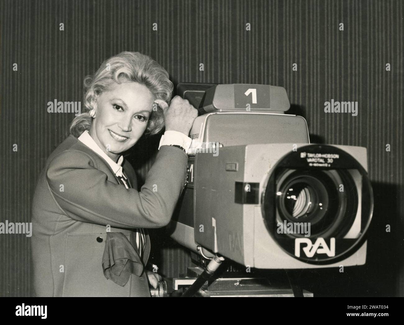 Italian film actress Luisa Rivelli with a RAI videocamera, 1980s Stock Photo