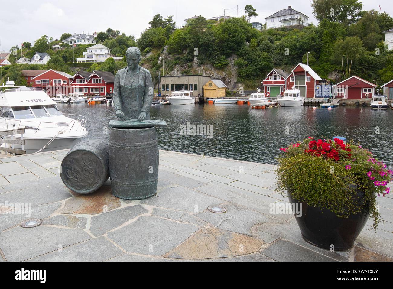 Norway, Vestland, Bekkjarvik - July 20, 2023: The statue Sildajenta commemorates the many women who worked in the herring factories until the end of t Stock Photo