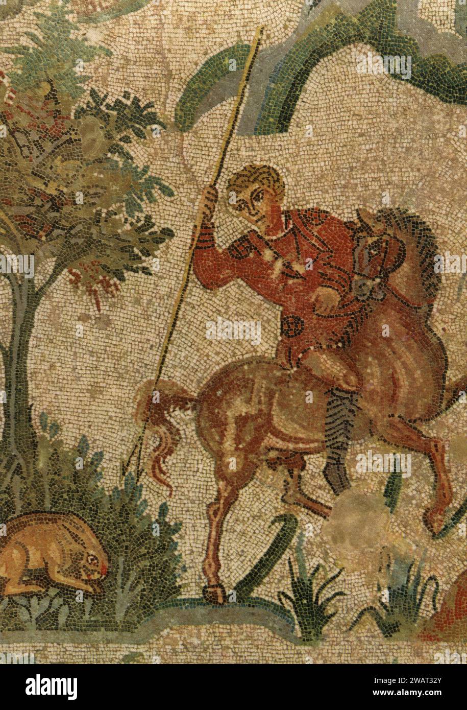Ancient mosaics hunting scene: The hare reached by the knight, Roman Villa del Casale, Piazza Armerina, Sicily, Italy 1960s Stock Photo
