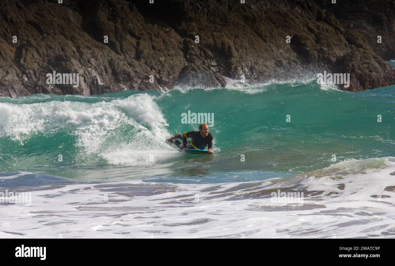 Body boarder catching the breaker at Kynance Cove, Cornwall. Cutting the wave. Stock Photo