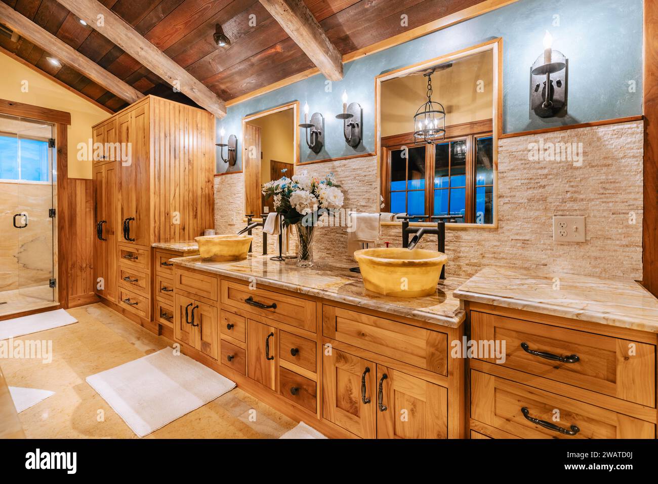 A bright and modern bathroom is featured in this image, boasting