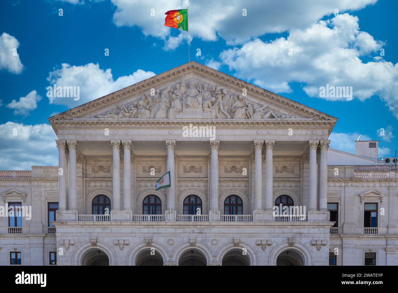 Front facade of the upper part of the Assembly of the Republic, Palacio de Sãoo Bento, Lisbon, blue sky background with clouds Stock Photo