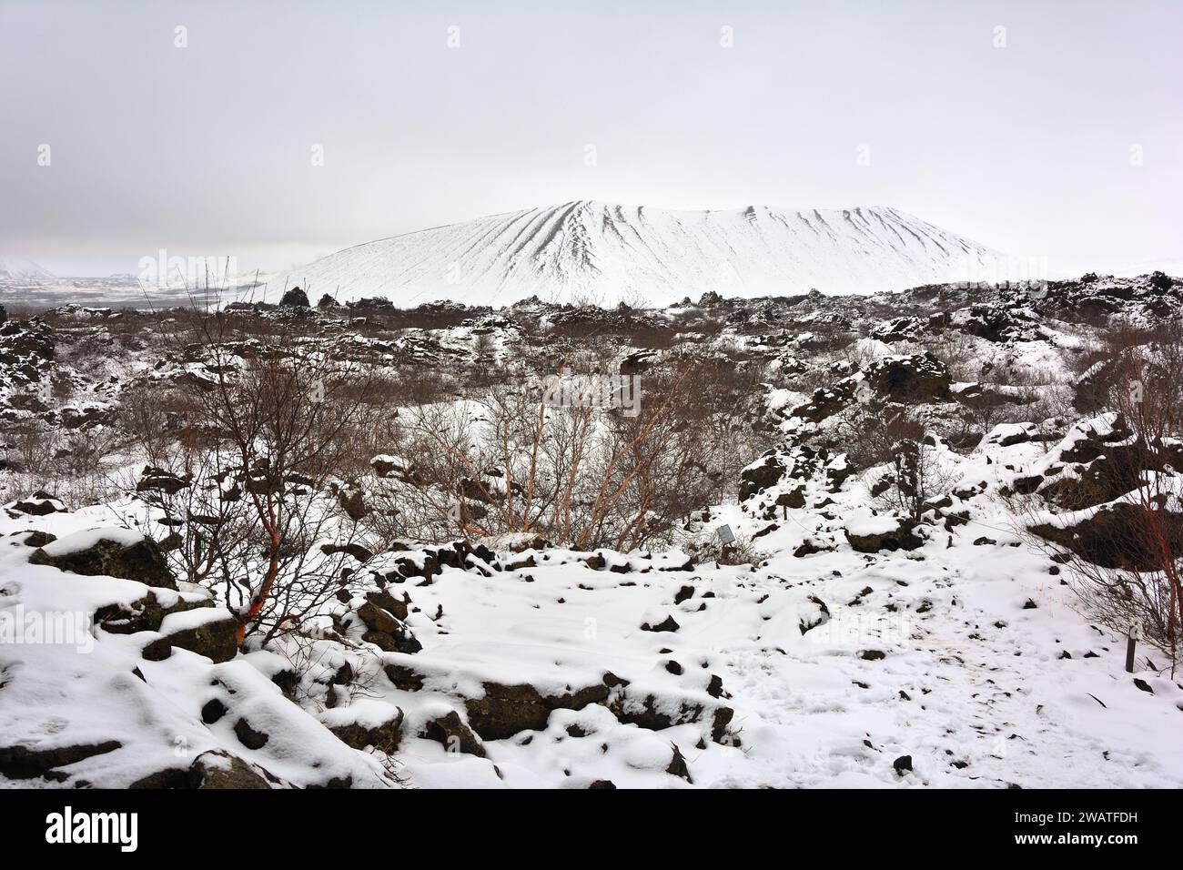 Hverfjall Volcano covered in snow from Dimmuborgir lava field. Myvatn, Iceland Stock Photo