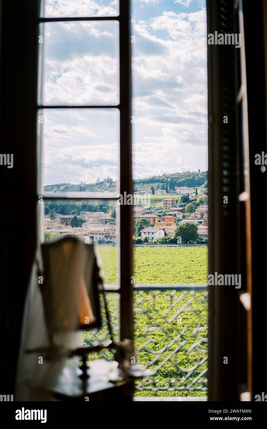 View from the window of sunny vineyards opposite old mansions at the ...