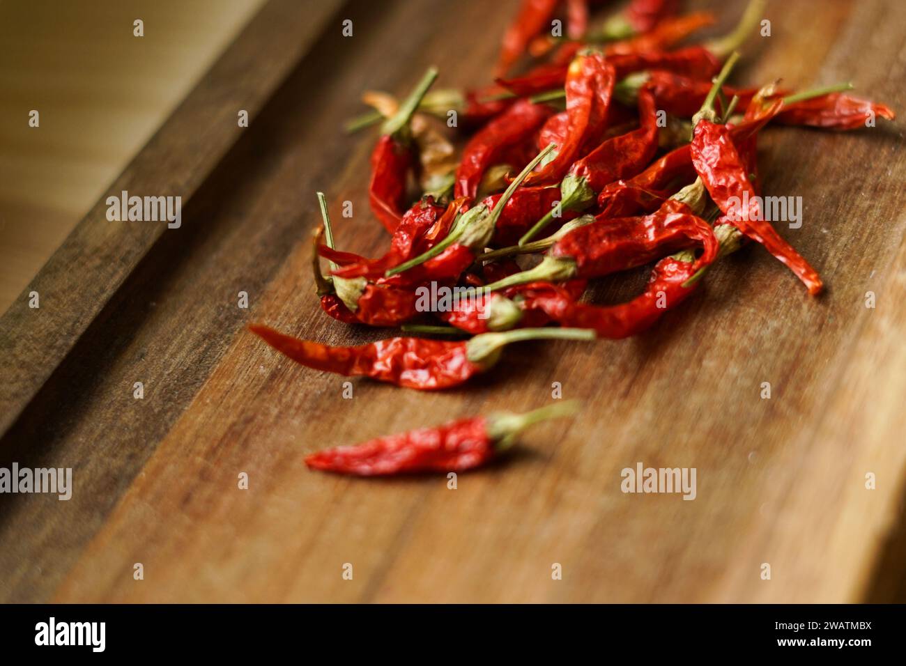 Red chilli peppers on the woodeb background. Stock Photo
