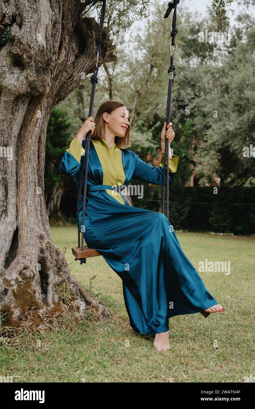 Old woman on swing hi-res stock photography and images - Alamy