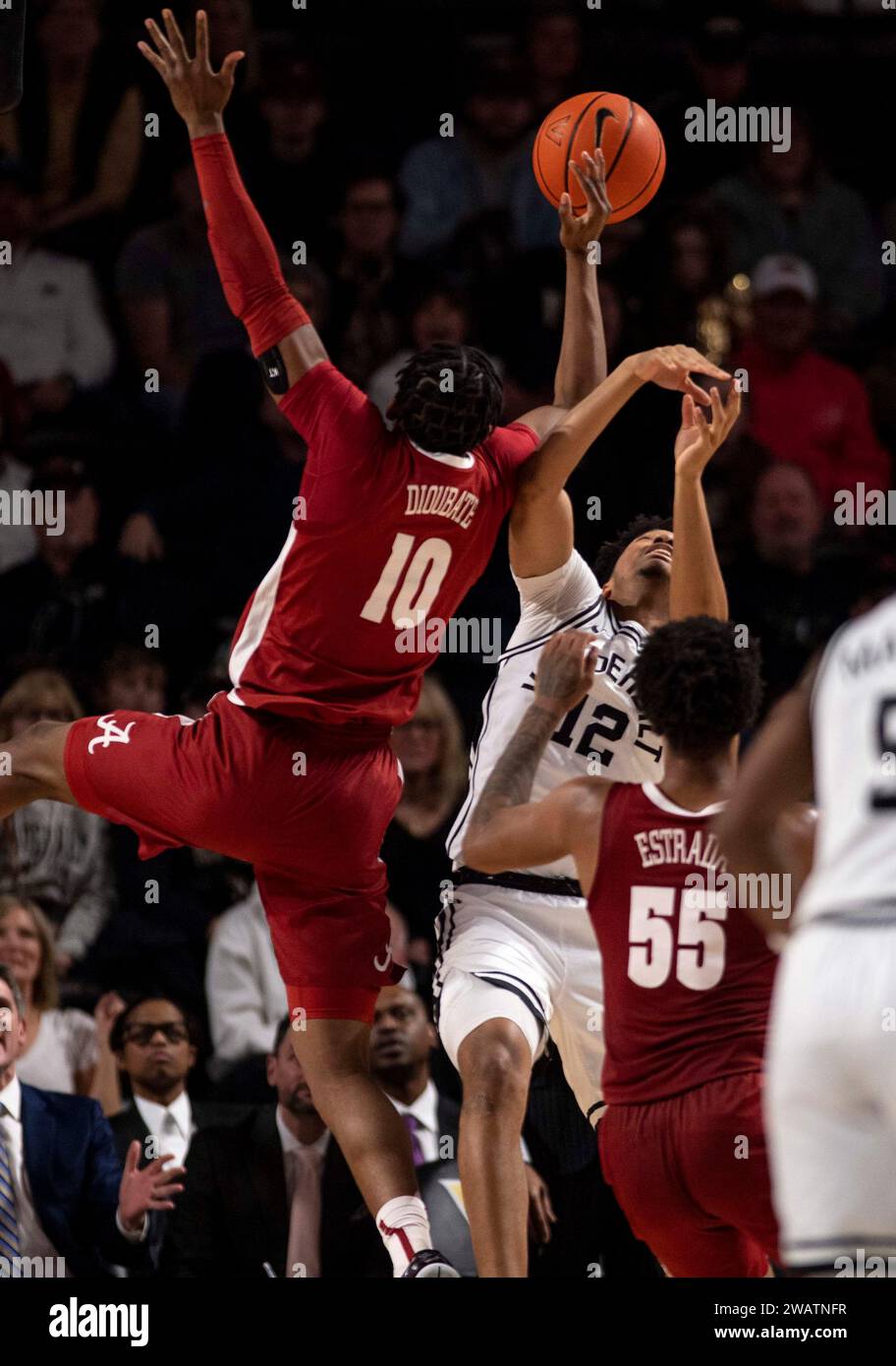 Nashville, Tennessee, USA. 6th Jan, 2024. Vanderbilt Commodores guard Evan Taylor (12) and Alabama Crimson Tide forward Mouhamed Dioubate (10) fight for the ball during the first half of his NCAA basketball at Vanderbilt University in Nashville. (Credit Image: © Camden Hall/ZUMA Press Wire) EDITORIAL USAGE ONLY! Not for Commercial USAGE! Stock Photo