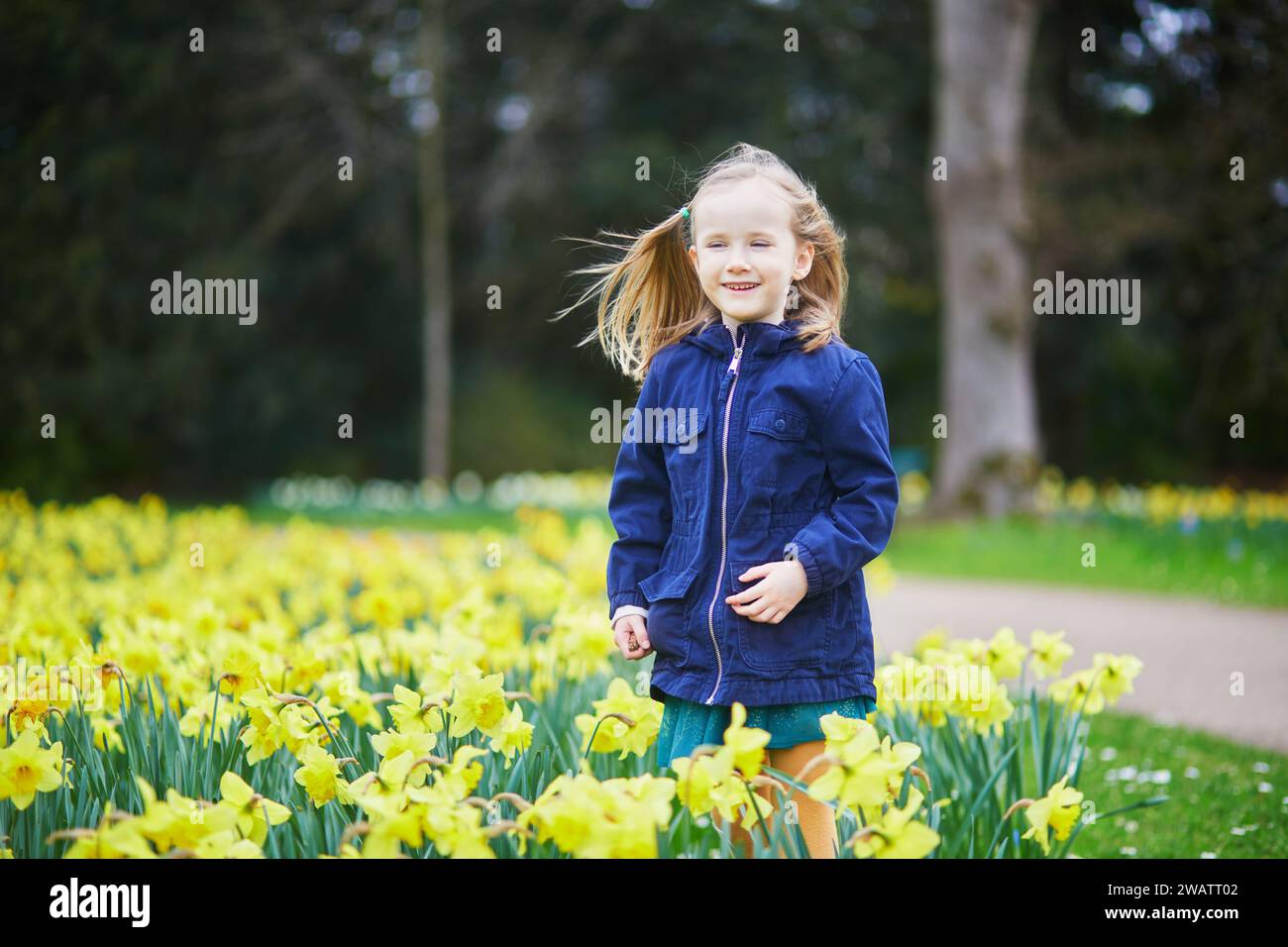 Springtime Kids Outside Adorable preschooler girl enjoying nice spring day in park during ...
