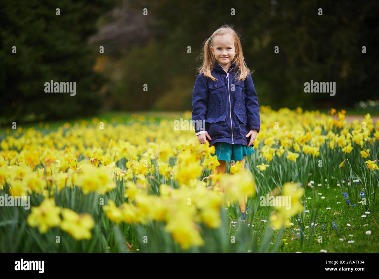 Springtime Kids Outside Adorable preschooler girl enjoying nice spring day in park during ...
