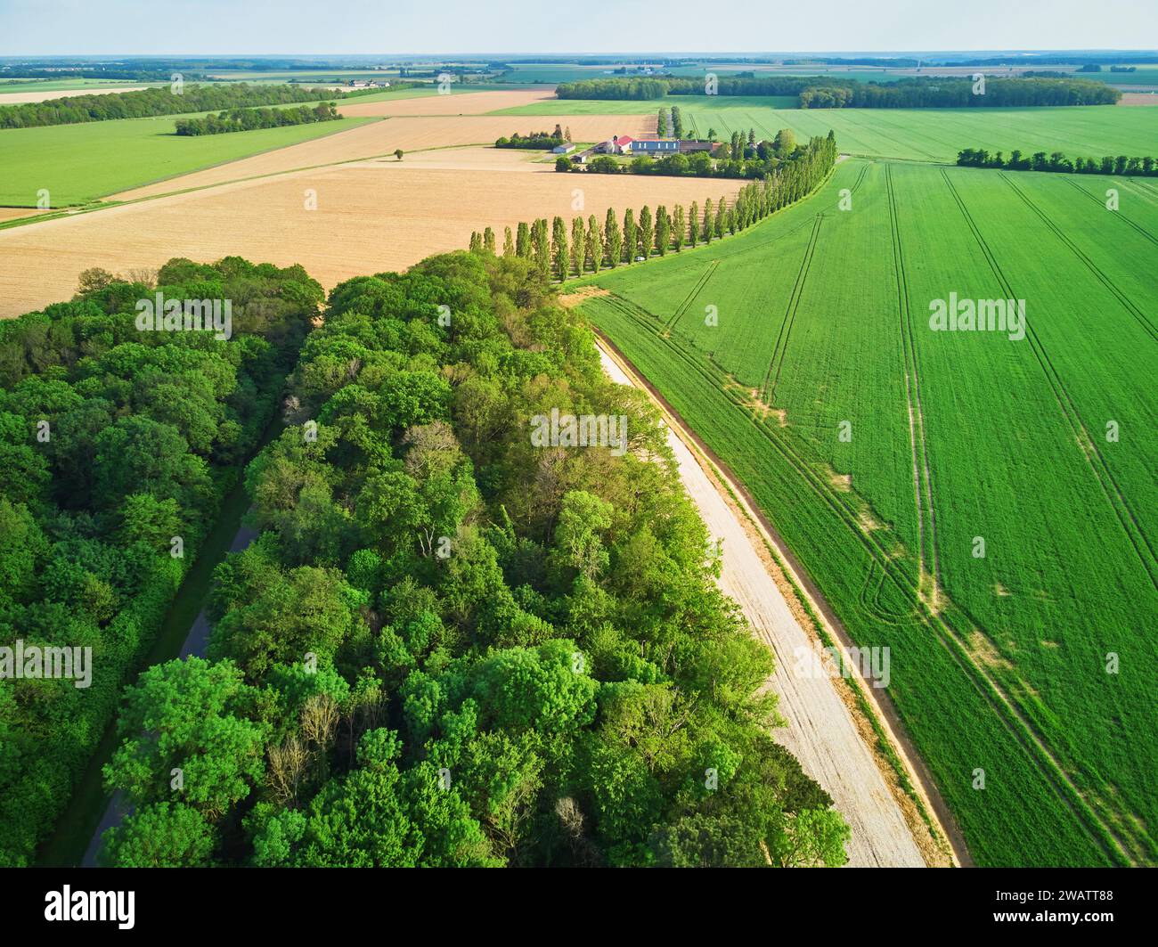 Aerial drone view of green fields and meadows in Yveliness,, near Paris