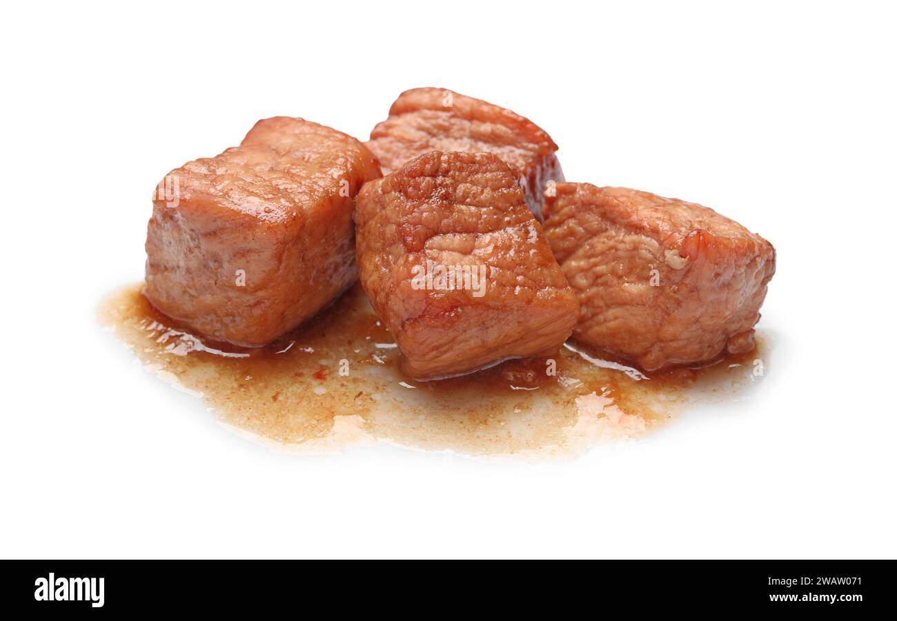 Pieces of delicious cooked beef isolated on white. Tasty goulash Stock Photo