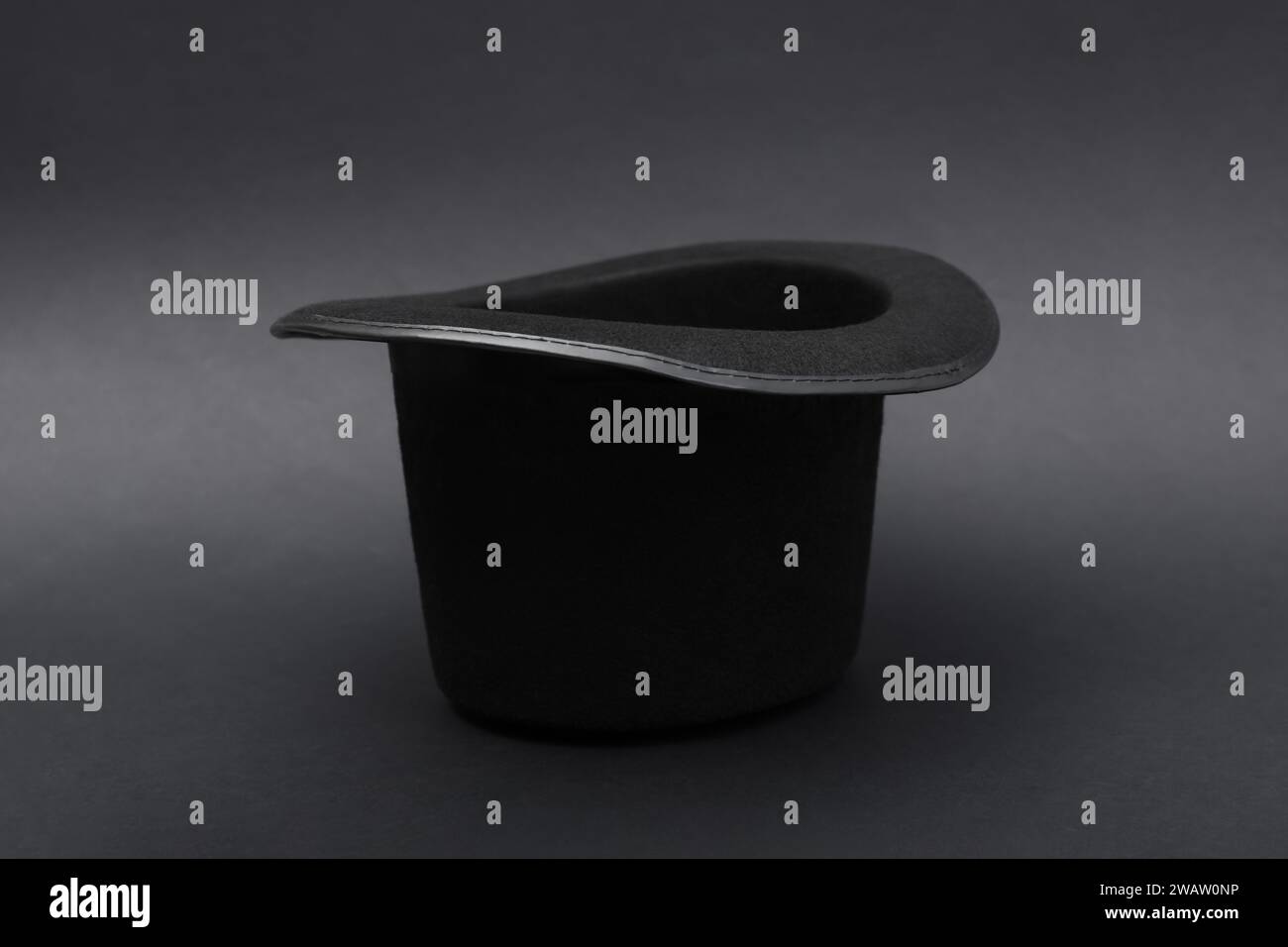 One magician top hat on dark grey background Stock Photo - Alamy