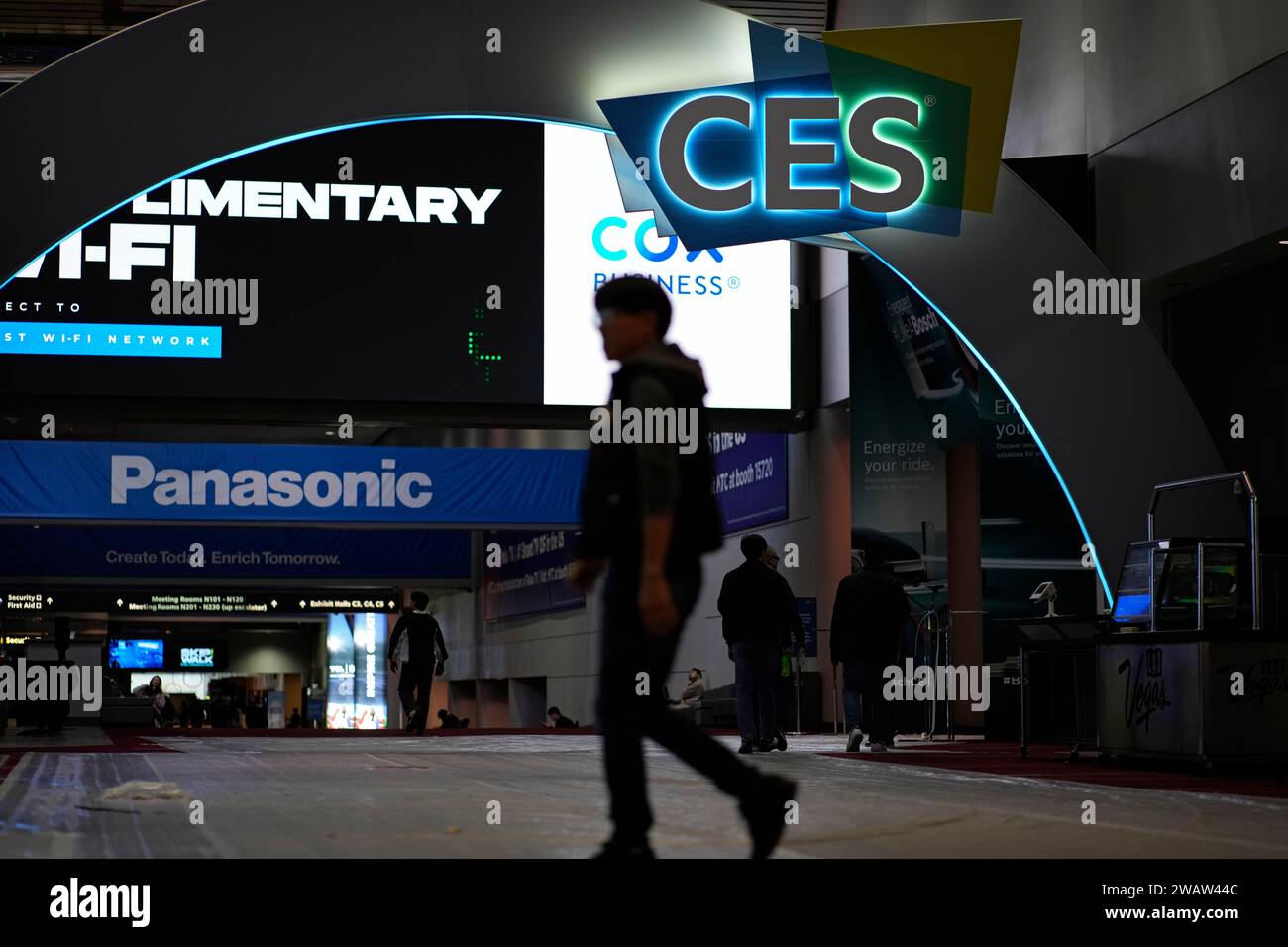 People walk through the Las Vegas Convention Center during setup ahead ...