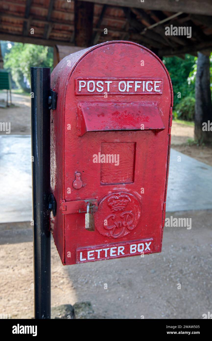 A former British Empire red post box still in use at Dabakolapatuna in the Jaffna region of northern Sri Lanka. Stock Photo