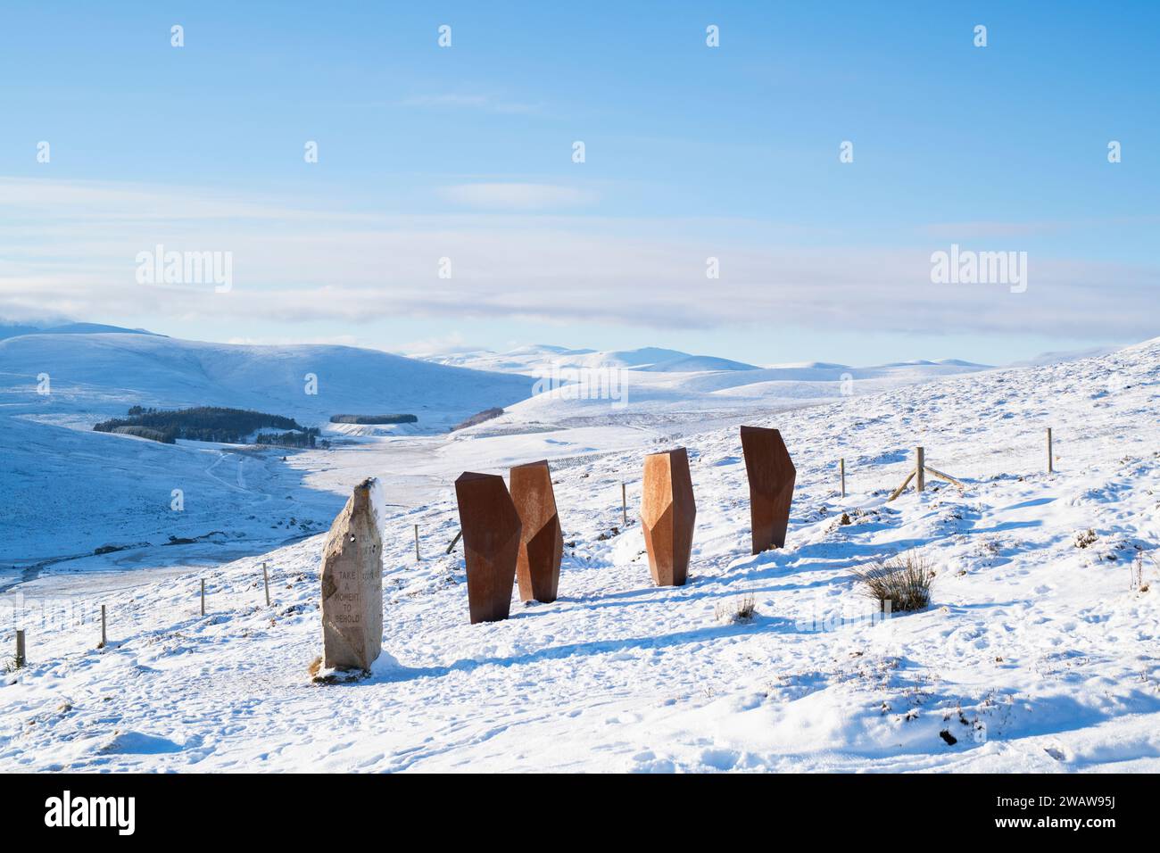 The Watchers and A Moment in Time sculpture in the snow. Cairngorms, Highlands, Scotland Stock Photo