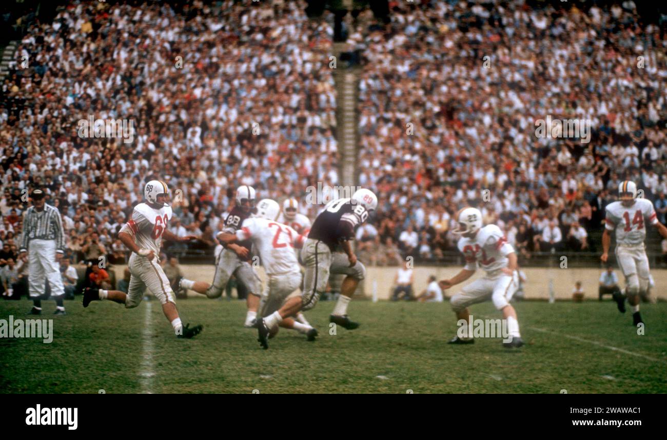 DALLAS, TX - SEPTEMBER 21: General view as #80 of the Texas A&M Aggies runs with the ball before fumbling after being hit by #22 of the Maryland Terrapins during an NCAA game on September 21, 1957 at the Cotton Bowl in Dallas, Texas.  The Aggies defetead the Terrapins 21-13.  (Photo by Hy Peskin) Stock Photo