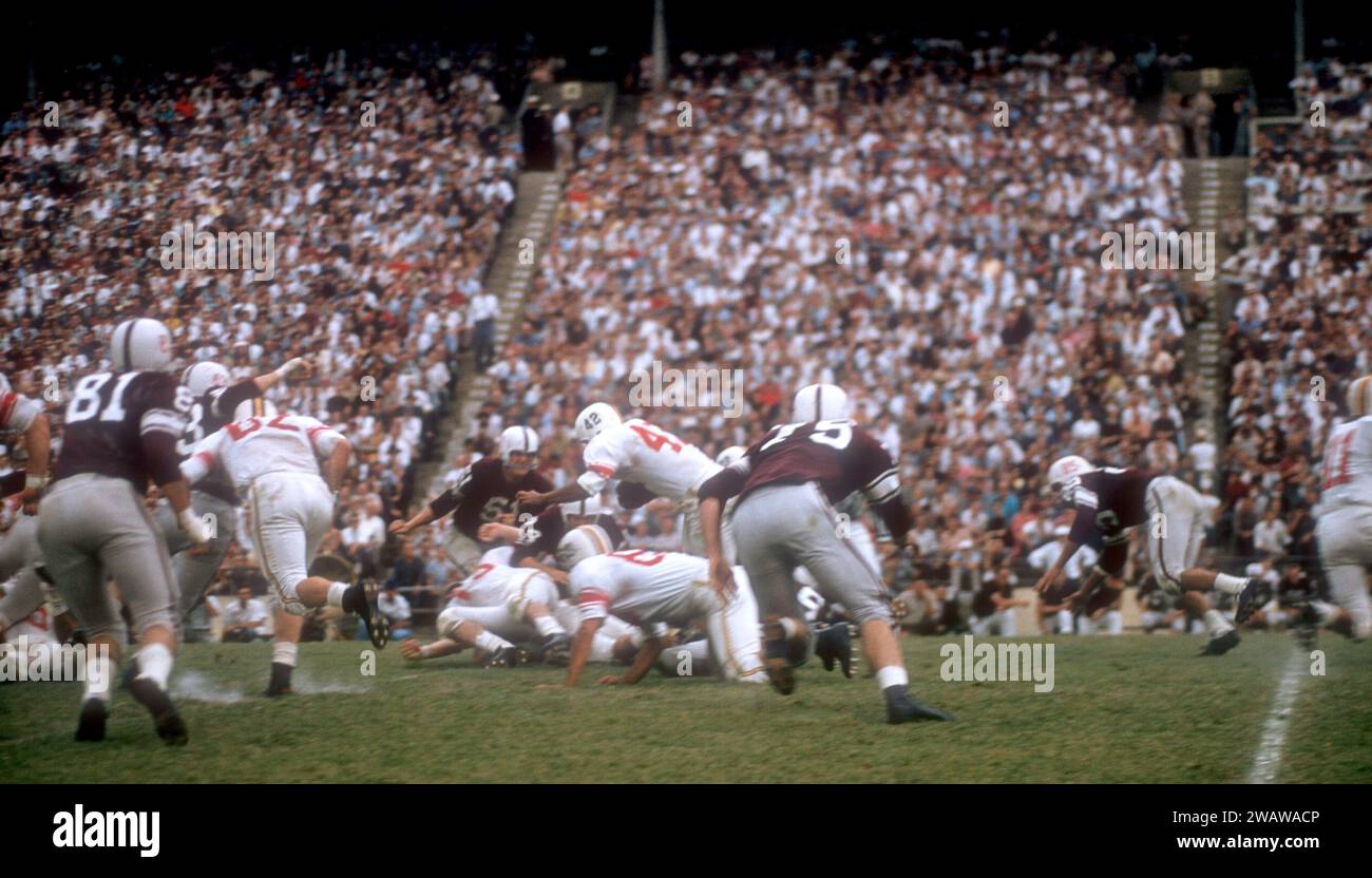 DALLAS, TX - SEPTEMBER 21: General view as #42 of the Maryland Terrapins gets tackled during an NCAA game against the Texas A&M Aggies on September 21, 1957 at the Cotton Bowl in Dallas, Texas.  The Aggies defetead the Terrapins 21-13.  (Photo by Hy Peskin) Stock Photo