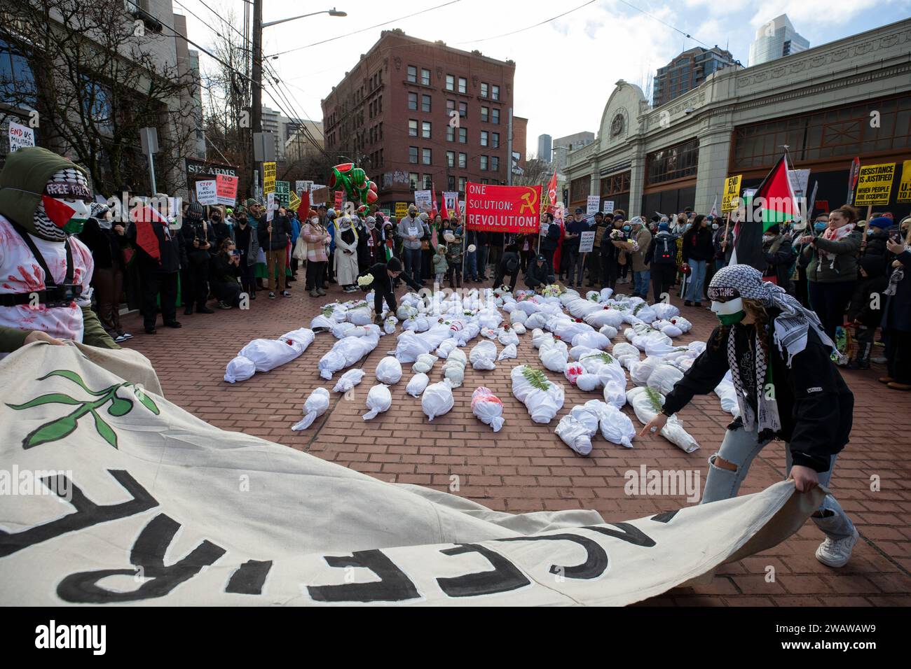 Seattle, Washington, USA. 6th January, 2024. Shrouded effigies of dead