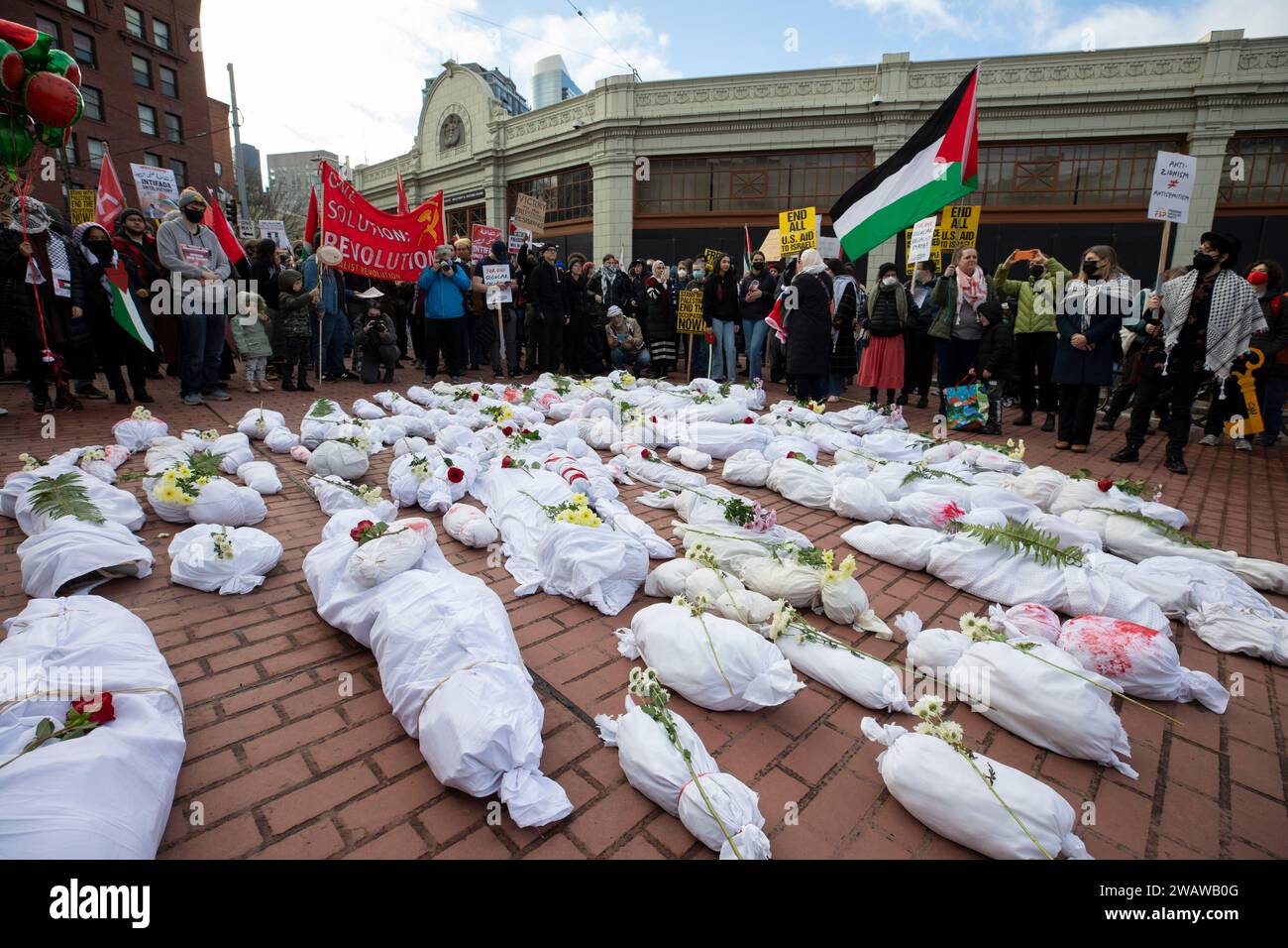 Seattle, Washington, USA. 6th January, 2024. Shrouded effigies of dead