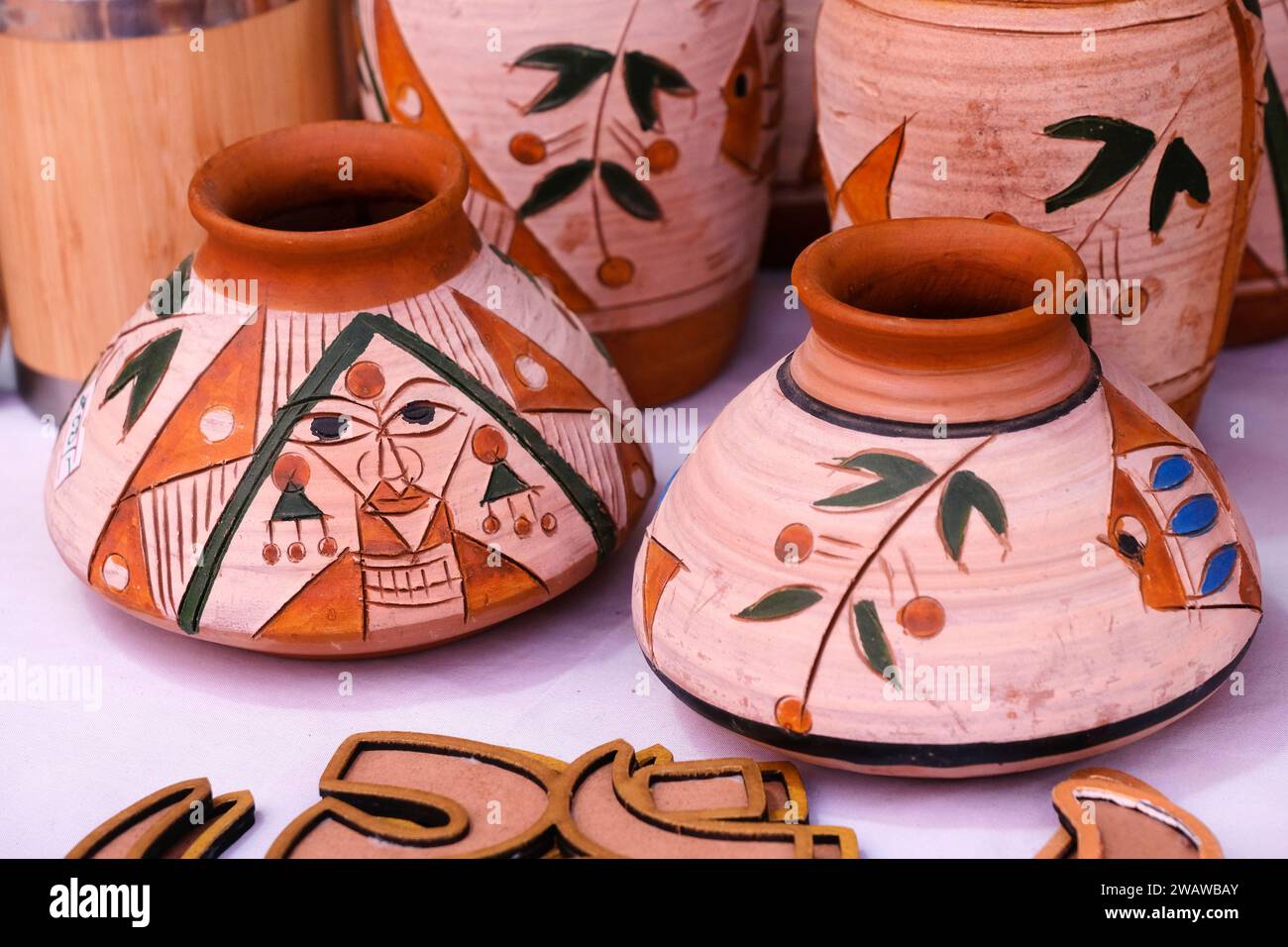 Collection of images with unglazed handmade pottery pot made of red clay. Teracota vase. Pottery