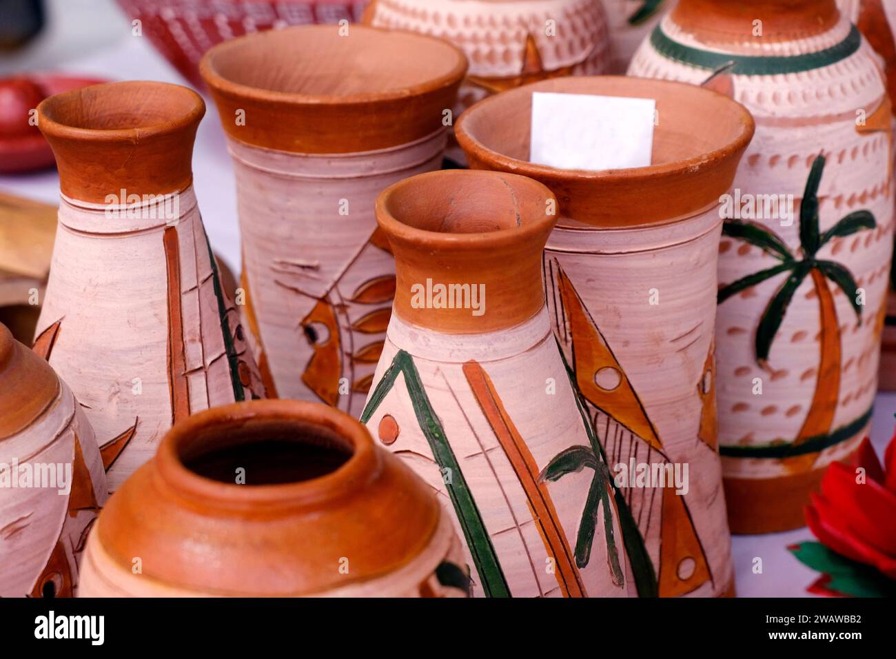 Collection of images with unglazed handmade pottery pot made of red clay. Teracota vase. Pottery