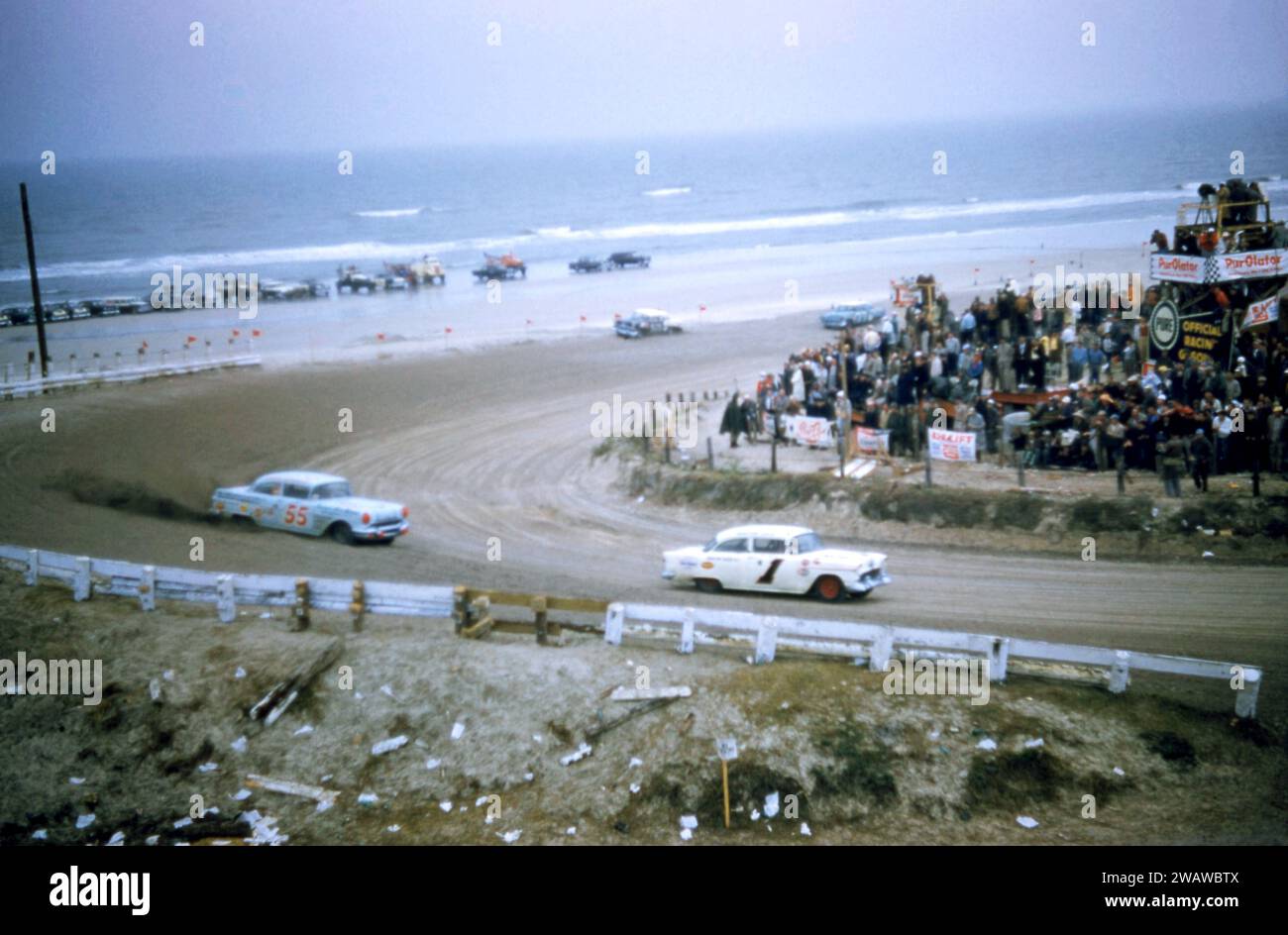 DAYTONA BEACH, FL - FEBRUARY 26: Bobby Myers in the #1 Chevrolet races past Junior Johnson in the #55 Pontiac after Johnson spun out during the 1956 NASCAR Daytona Beach and Road Course race on February 26, 1956 in Daytona Beach, Florida. (Photo by Hy Peskin) *** Local Caption *** Junior Johnson;Bobby Myers Stock Photo