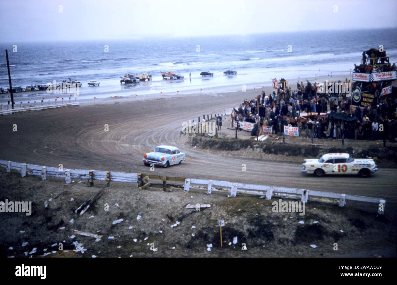 DAYTONA BEACH, FL - FEBRUARY 26: Junior Johnson in the #55 Pontiac spins out as Jim Cushman in the #10 Buick drives past him during the 1956 NASCAR Daytona Beach and Road Course race on February 26, 1956 in Daytona Beach, Florida. (Photo by Hy Peskin) *** Local Caption *** Junior Johnson;Jim Cushman Stock Photo