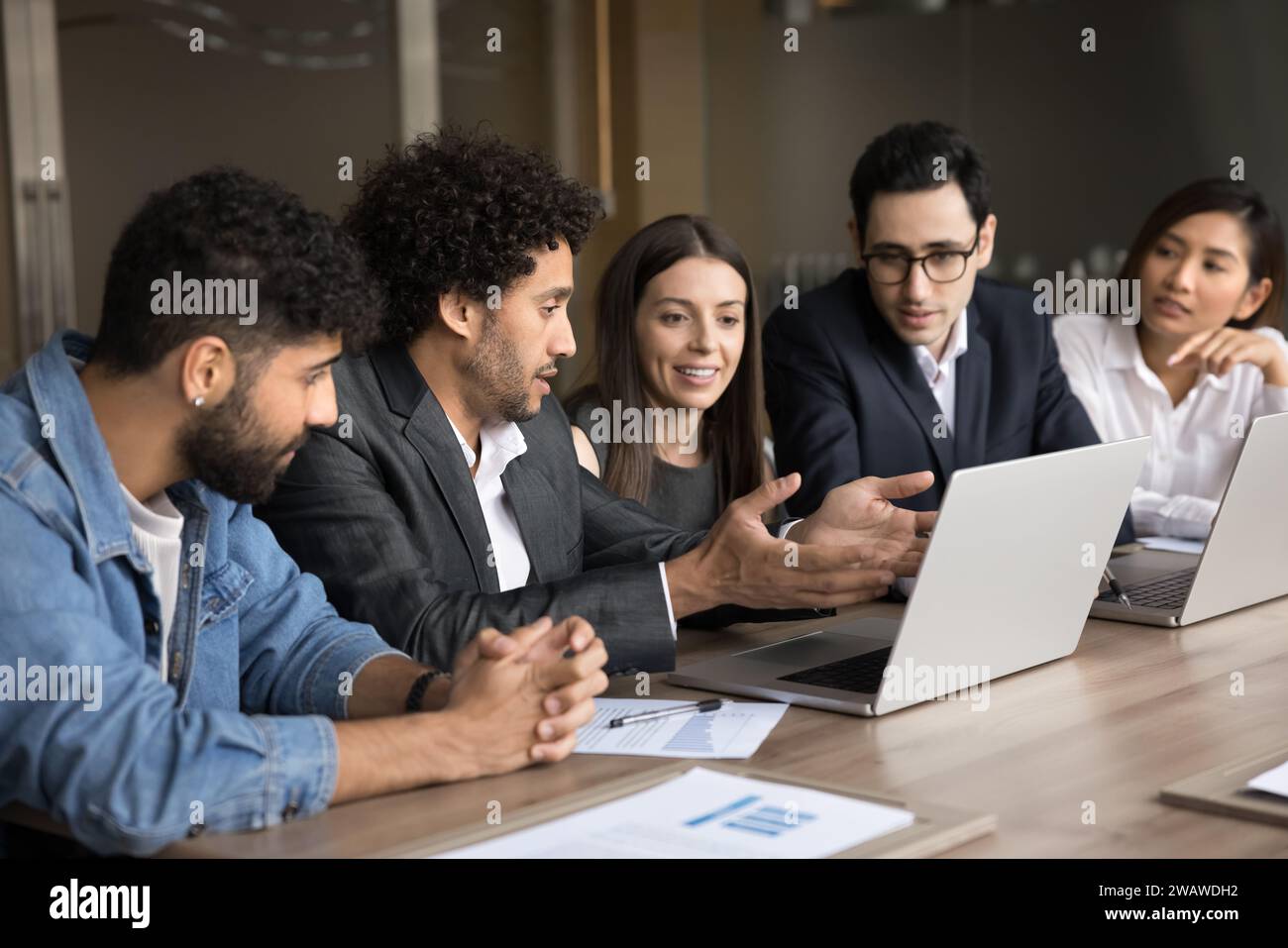 Young Arab project manager man presenting creative ideas to team Stock Photo