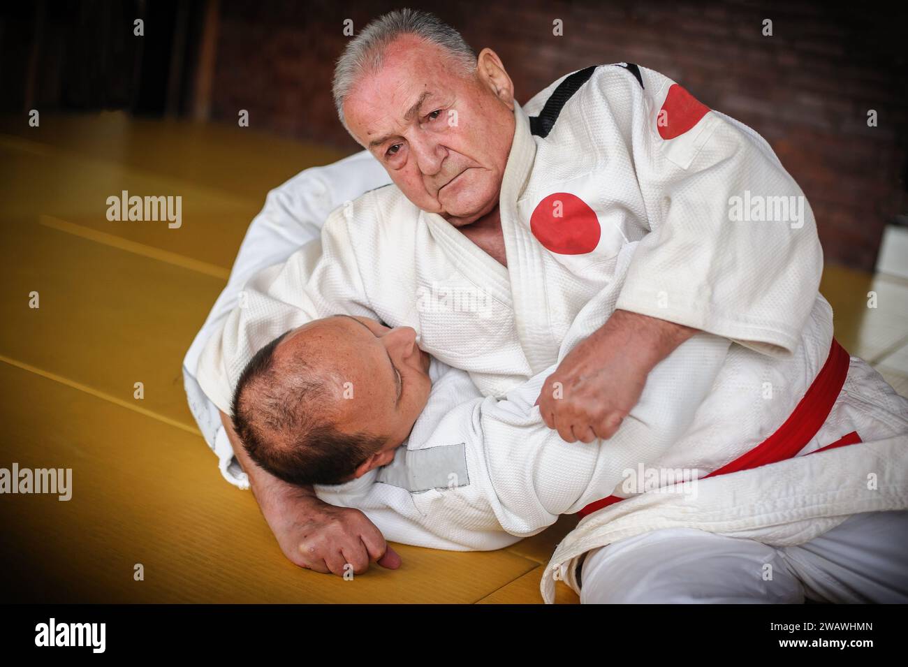 Judo sensei master instructor in traditional gi kimono demonstrate judo