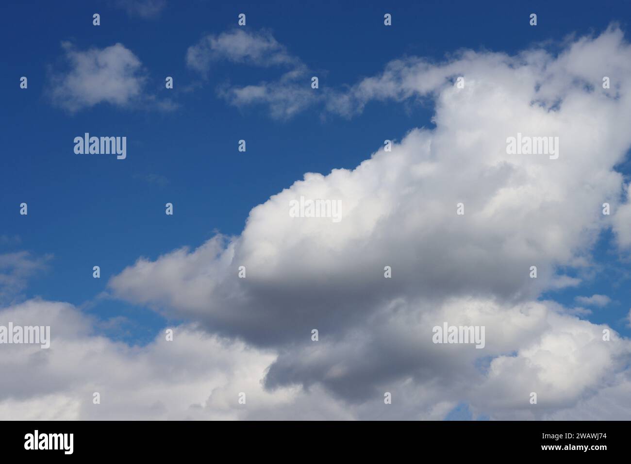white clouds disappear in the hot sun on blue sky. Timelapse motion