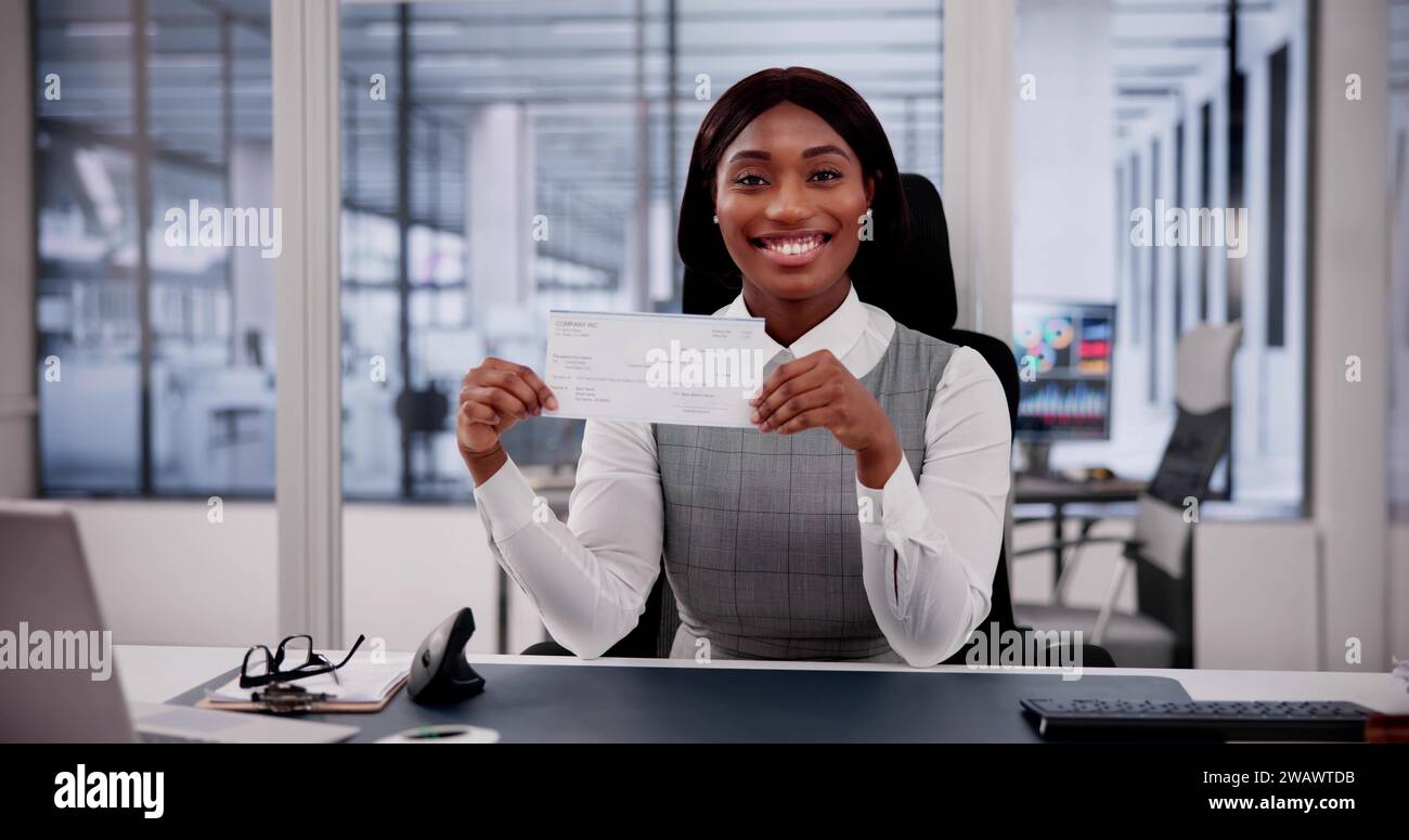 Business Woman Holds Checkbook, Examining Paycheck and Cheque Stock ...