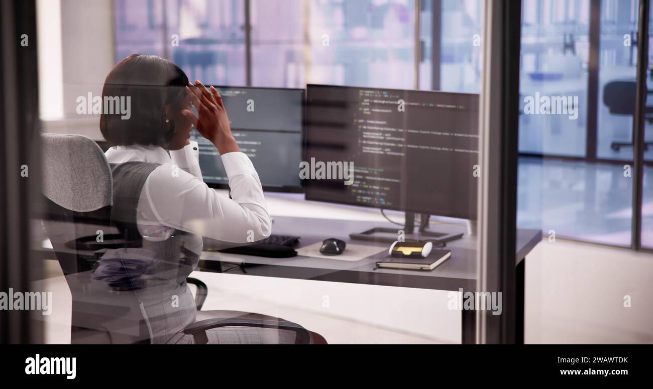 Business Engineer Analyzing Broken Code on Computer Screen Stock Photo