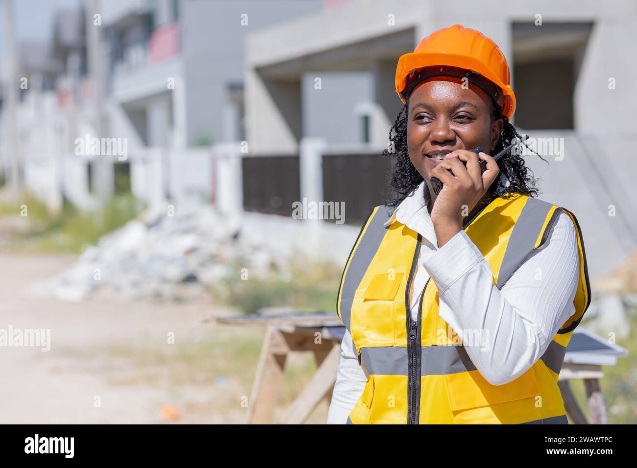 Smart women worker, Professional construction engineer builder foreman contractor work control operate construction site in project manager position. Stock Photo