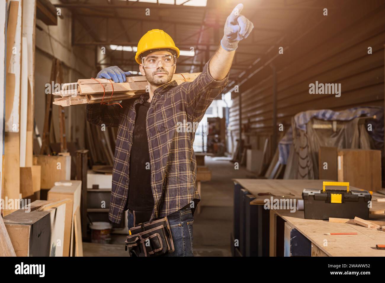 portrait smart builder wood male furniture maker, sawmill worker professional standing strong