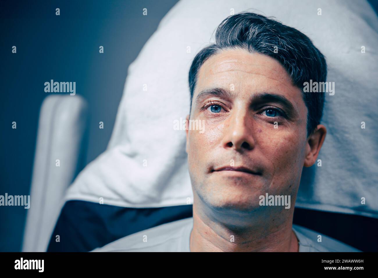Adult mature male model handsome man human head closeup profile humanoid look blue color tone Stock Photo