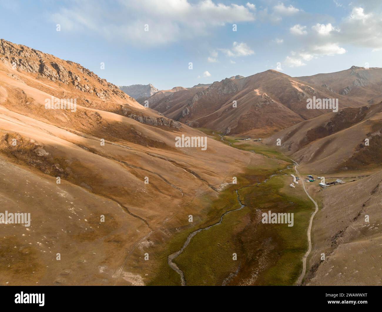 Aerial view of mountain valley with gravel road, Naryn region, Kyrgyzstan Stock Photo