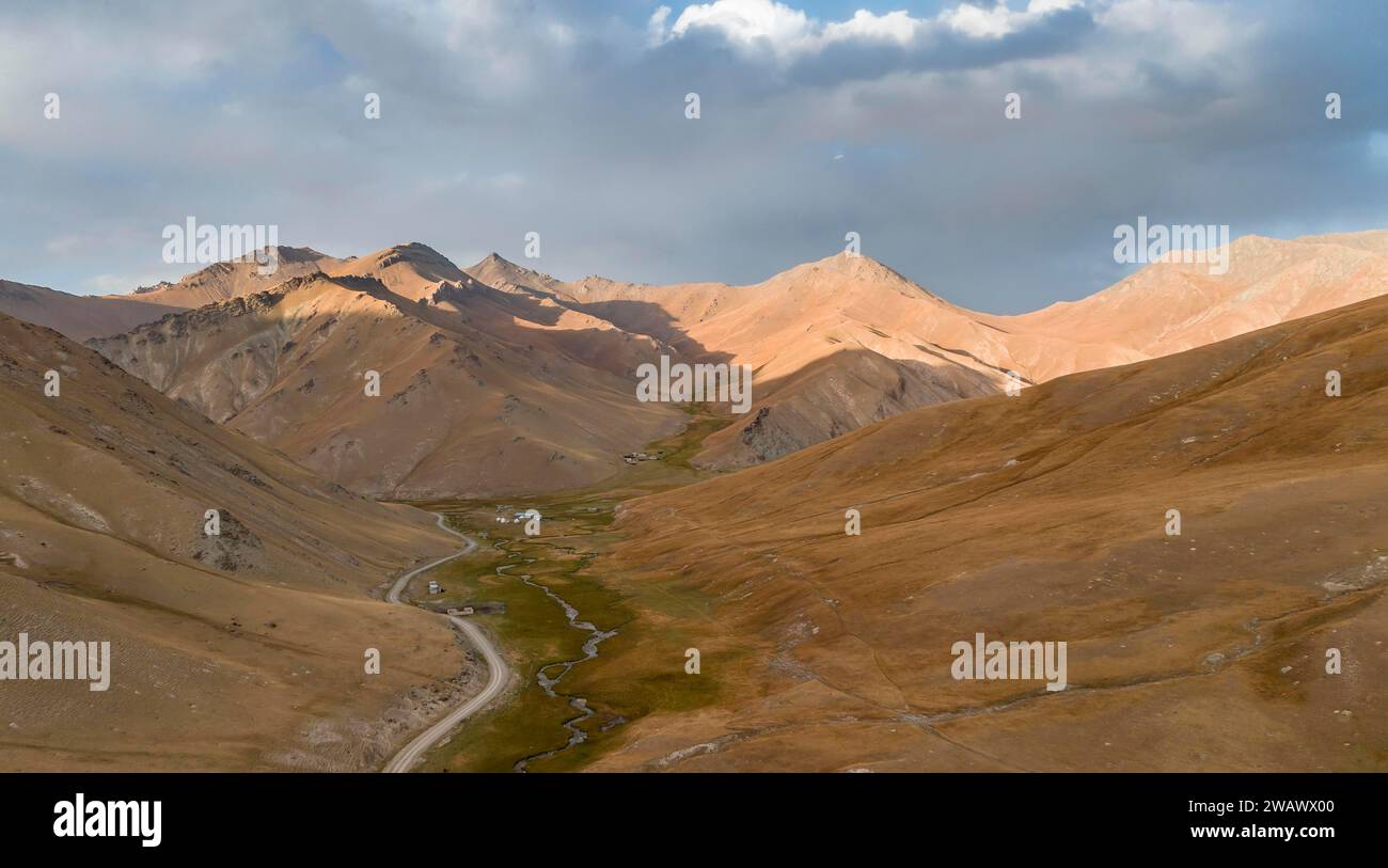 Aerial view of mountain valley with gravel road, Naryn region, Kyrgyzstan Stock Photo
